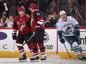 Tobias Rieder of the Arizona Coyotes, left, celebrates with Radim Vrbata after scoring an empty net goal against the Vancouver Canucks on Jan. 26, 2017 in Glendale, Ariz.