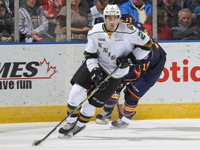 Evan Bouchard of the Knights pulls away with the puck against the Barrie Colts during an OHL game at Budweiser Gardens in London, Ont. The somewhat forgotten Bouchard will be remembered if his pre-draft declaration of an NHL-ready game comes to fruition next fall.