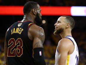 Stephen Curry of the Golden State Warriors exchanges words with LeBron James of the Cleveland Cavaliers in overtime during Game 1 of the 2018 NBA Finals at ORACLE Arena on May 31, 2018 in Oakland, California. (Ezra Shaw/Getty Images)