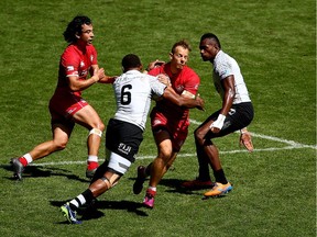 Harry Jones is tackled by Fiji's Jasa Veremalua
on day two of the HSBC London Sevens at Twickenham Stadium on June 3, 2018 in London, United Kingdom.