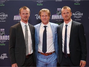 After all these years, it's finally gotten easy: Henrik's the one in the dark suit. The Sedins join ROY candidate Brock Boeser in Vegas on Wednesday.