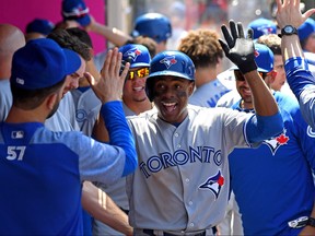 Curtis Granderson of the Toronto Blue Jays is congratulated in the dugout after hitting a solo home run in the sixth inning of the game against the Los Angeles Angels of Anaheim at Angel Stadium on June 24, 2018 in Anaheim, Calif. (Jayne Kamin-Oncea/Getty Images)