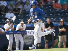 Duke University’s Griffin Conine (9) runs into score during a May 2018 game against Wake Forest University at the Atlantic Coast Conference NCAA college baseball tournament at Durham Bulls Athletic Park in Durham, N.C.