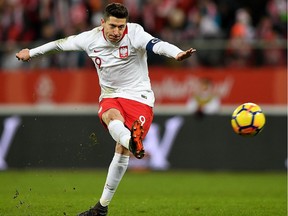 In this file photo on March 23, Poland's forward Robert Lewandowski shoots during an international friendly against Nigeria in Wroclaw, Poland, in preparation of the World Cup.