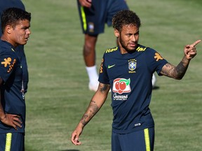 Brazil's defensive leader Thiago Silva (left) takes direction from offensive dynamo Neymar during a Brazil training session in Sochi, Russia, on Thursday, ahead of Brazil’s World Cup soccer opener against Switzerland on Sunday.