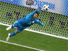 Egypt's goalkeeper Mohamed El Shenawy makes a save from a Uruguay's forward Edinson Cavani shot during the Russia 2018 World Cup Group A football match between Egypt and Uruguay at the Ekaterinburg Arena in Ekaterinburg on June 15, 2018.