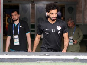 Egypt's forward Mohamed Salah walks to the pitch for a training session at the Akhmat Arena stadium in Grozny, Russia on Sunday, June 17, 2018, for the FIFA World Cup.