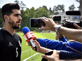 Iran's midfielder Saeid Ezatolahi meets with journalists during a training session in Bakovka outside Moscow on Saturday ahead of Monday's 2018 World Cup Group B match between Iran and Portugal.