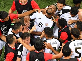 Costa Rica's centreback Kendall Waston celebrates with teammates  after scoring his team's only goal of the  2018 World Cup during Wednesday's 2-2 tie against Switzerland at the Nizhny Novgorod Stadium in Nizhny Novgorod.
