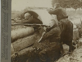 First World War stereoview of Belgian snipers in the trenches firing from behind a drain pipe. The stereoview featured two similar images that appeared to be 3-D when you looked at them through a stereoscopic viewer. This image was produced by Underwood and Underwood, an American company that was known for stereoviews of news events. Richard Crawley collection.