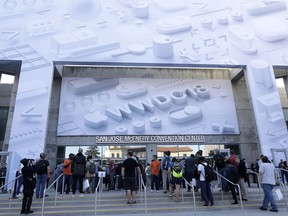 Attendees line up outside of the McEnery Convention Center for the Apple Worldwide Developers Conference in San Jose, Calif., Monday, June 4, 2018.