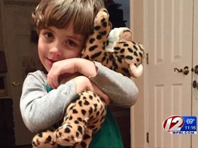 Four-year-old Will Ketcher hugs his new stuffed cheetah from the Rhode Island State Police. (Screen grab)