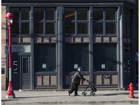 A man walks along the 100 block West Pender in Vancouver's Chinatown.