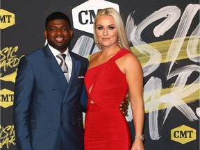 Hockey player P.K. Subban of the Nashville Predators and skier Lindsey Vonn pose for photo at the CMT Music Awards at the Bridgestone Arena in Nashville on June 6, 2018.