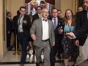 House Chief Deputy Whip Rep. Patrick T. McHenry, R-N.C., is surrounded by reporters as he walks to the chamber for votes on an immigration bill crafted by GOP conservatives, at the Capitol in Washington, Thursday, June 21, 2018. The bill was defeated and Republican leaders delayed a planned vote on a compromise GOP package with the party's lawmakers fiercely divided over an issue that has long confounded the party.