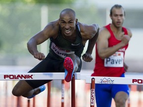 Canada's Damian Warner leads Bogdan Pavel in the 110M Hurdles at the Harry Jerome Track Classic at Swangard Stadium on Tuesday.