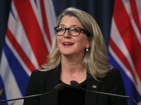 Agriculture Minister Lana Popham provides an update about fish farms during a press conference Wednesday at the B.C. legislature in Victoria.