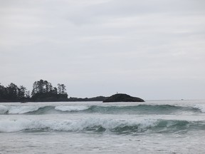 The Coast Guard is searching for multiple people in the water off the coast of Tofino after a boat capsized early Friday. Reports indicate the search is taking place near Chesterman Beach. Waves roll onto Chesterman Beach in this file photo.