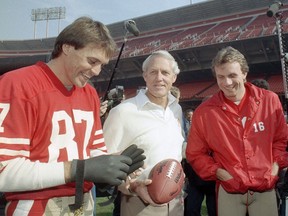 San Francisco 49ers receiver Dwight Clark, head coach Bill Walsh and quarterback Joe Montana (left to right) pictured in January 1985 at San Francisco's Candlestick Park. Clark, whose most reception was simply known as ‘The Catch’ that sent the Niners to their first Super Bowl (and launched an NFL dynasty in the 1980s) died June 4, 2018, one year after revealing he had ALS. He was 61.