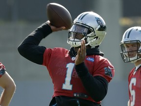 Carolina Panthers' Cam Newton throws a pass during the team's practice in Charlotte, N.C., Wednesday, June 13, 2018. (AP Photo/Chuck Burton)
