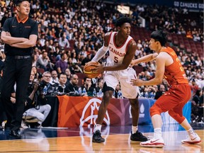 R.J. Barrett of Team Canada is guarded by Qian Wu of Team China during the Pacific Rim Basketball Classic on Friday at Rogers Arena in Vancouver. The teams will continue their exhibition series on Sunday in Victoria.