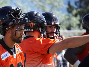 B.C. Lions quarterbacks, from left, Jonathon Jennings, Cody Fajardo and Ricky Lloyd practise at training camp in Kamloops last month. Lloyd took over from an injured Fajardo in the team's first pre-season game on Friday and threw three touchdown passes in a 36-23 victory in Calgary.