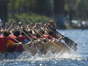 People enjoy the weather around False Creek in Vancouver, B.C.