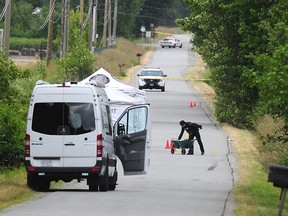 Mounties investigate after two people were gunned down in Surrey in June.