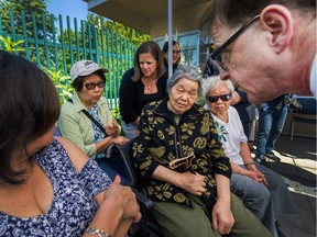 Health Minister Adrian Dix chats with seniors at Collingwood Neighbourhood House where he joined the B.C. seniors advocate, Isobel Mackenzie, for an announcement on increasing support for those caring for aging loved ones.