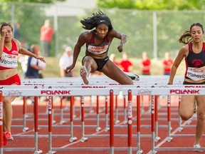 Canadian Farrah Jacques, centre, won the RYU 100-metre women's hurdles on Wednesday during the second day of The Vancouver Sun/Harry Jerome International Track Classic at Swangard Stadium in Burnaby. Diane Voloshin, left, and Katarina Vlahovic were in the final heat.