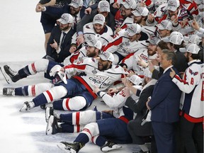 The Washington Capitals pose for a team photograph on the ice after the Capitals defeated the Vegas Golden Knights in Game 5 of the NHL hockey Stanley Cup Finals Thursday, June 7, 2018, in Las Vegas.