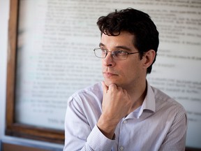 Author Steven Galloway is seen in his office at the University of British Columbia in a file photo from 2014.