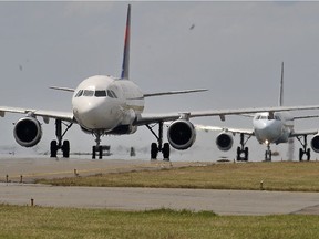 An aircraft lines up for takeoff at Vancouver International Airport.