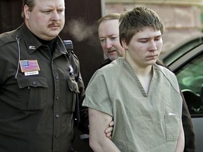 In this March 3, 2006, file photo, Brendan Dassey, is escorted out of a Manitowoc County Circuit courtroom in Manitowoc, Wis.