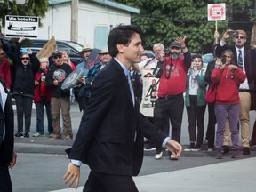 Protesters opposed to the Kinder Morgan Trans Mountain pipeline expansion shout at Prime Minister Justin Trudeau as he arrives for a discussion with the Indigenous Advisory and Monitoring Committee, on the Cheam First Nation near Chilliwack.