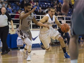 UBC Thunderbirds guard Phil Jalalpoor drives past Manitoba's Justus Alleyn at War Memorial Gym on Nov. 18, 2016.