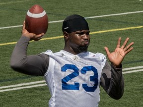 Then-Montreal Alouettes running back Brandon Rutley tosses the ball around during an August 2016 practice in Saint-Leonard, Que.