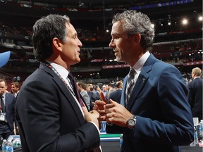 Toronto Maple Leafs president Brendan Shanahan (left) and Vancouver Canucks president Trevor Linden exchange pleasantries at the 2017 NHL Entry Draft in Chicago.