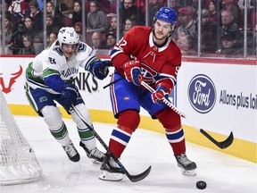 Jonathan Drouin of the Canadiens skates with the puck in front of Loui Eriksson of the Vancouver Canucks during NHL action at the Bell Centre on Jan. 7 in Montreal.