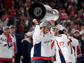 Jay Beagle, holding the Stanley Cup and cheering with Washington Capitals' teammate T.J. Oshie, joined the Canucks this off-season and hopes to fill some of the leadership void created by the departure of the Sedins.