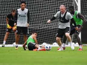 D.C. United player Wayne Rooney, with ball, takes part in a training session ahead of tonight's visit from the Vancouver Whitecaps.