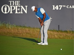 Tiger Woods putts on the 18th green during his first round at The 147th Open golf championship at Carnoustie, Scotland on Thursday.