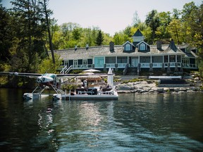 A float plane sits docked outside of a cottage in Ontario’s Muskoka area. Prices of country retreats have jumped 13 per cent in the past year.