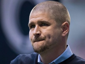 Vancouver Whitecaps head coach Carl Robinson walks onto the field before MLS soccer action against Real Salt Lake in Vancouver on Friday, April 27, 2018. Robinson is happy with how his players performed on the pitch in last week's 1-0 loss to the Colorado Rapids, but said they need a little something else to secure a win when they host the Chicago Fire on Saturday.