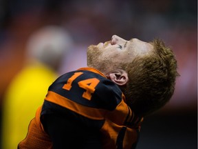 B.C. Lions' quarterback Travis Lulay sits on the sideline after leaving the game with an injury during the first half of a CFL football game against the Montreal Alouettes in Vancouver, B.C., on Friday September 8, 2017.