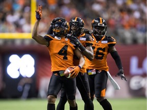 B.C. Lions' Garry Peters, from left to right, Anthony Thompson and Solomon Elimimian celebrate an interception against the Montreal Alouettes during CFL action in Vancouver on June 16, 2018. The Leos insist their problems on defence can be "easily" fixed.