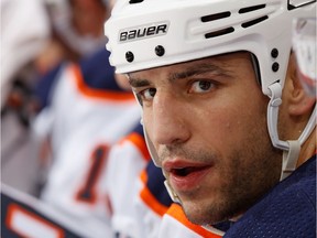 Milan Lucic of the Edmonton Oilers looks on from the bench.