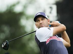 Sergio Garcia tees off on the second hole during round one of the Canadian Open at the Glen Abbey Golf Club in Oakville, Ont., on Thursday. David Hearn and Nick Taylor lead the Canadian contingent after the weather-shortened first round.