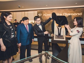 At the grand opening celebration of Kimberlite Diamond's first North American flagship in Vancouver, the executives of the brand unveil the $26-million The Moon Goddess necklace. From the left: Head of Canada Erica Chen, President Dong Liusheng, CEO Kellan Dong and Chief Designer Zhu WenJun.