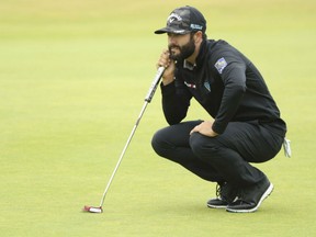 Adam Hadwin of Abbotsford, B.C., the lone Canadian in the field at the British Open, looks over a putt during second-round action Friday at Carnoustie, Scotland. Hadwin fired a 1-under 70 to sit in a tie for 40th spot at 1-over 143 heading into weekend play.